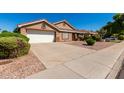 A charming single-story home with a two-car garage and low maintenance desert landscaping in a vibrant neighborhood at 1147 N Marvin St, Gilbert, AZ 85233