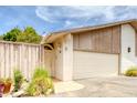 Exterior view of the home with a two car garage, and desert landscaping at 1550 N Stapley Dr # 6, Mesa, AZ 85203
