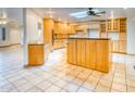 Open concept kitchen with lots of cabinet space, granite countertops, and skylight at 1550 N Stapley Dr # 6, Mesa, AZ 85203