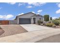 Charming single-story home with a two-car garage and desert landscaping at 18100 W College Dr, Goodyear, AZ 85395