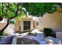 Inviting walkway leading to a charming home with mature shade tree and decorative front door at 1861 E Bendix Dr, Tempe, AZ 85283