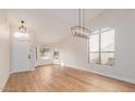Bright, open living area with high ceilings, wood floors and modern light fixtures at 20929 N 37Th Way, Phoenix, AZ 85050
