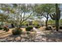 Beautiful desert landscaping and pavers lead up to this luxury home at 22022 N Calle Royale Dr, Scottsdale, AZ 85255