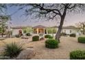 Well-manicured desert landscaping and charming walkway leading to the entrance of this home at 22022 N Calle Royale Dr, Scottsdale, AZ 85255