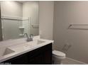 Modern bathroom with double sinks, a large mirror, and sleek fixtures at 22895 N 183Rd Dr, Surprise, AZ 85387
