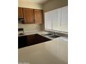 Kitchen showcasing the stainless steel sink with a window view at 3102 N Woodburne Dr, Chandler, AZ 85224