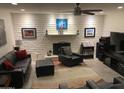 Cozy living room featuring a brick fireplace, neutral walls, and comfortable seating at 3924 E Cortez St, Phoenix, AZ 85028