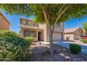 Home exterior with a two-car garage, neutral color scheme and an easy to care for front yard at 41251 W Barcelona Dr, Maricopa, AZ 85138