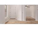 Inviting entryway showcasing neutral paint, tile flooring, and seamless access to the living areas at 4143 E Sundance Ave, Gilbert, AZ 85297