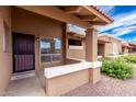 Inviting covered front porch with a decorative ledge and trimmed entry, providing a warm welcome at 420 W Yukon Dr # 8, Phoenix, AZ 85027