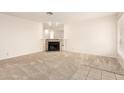 Spacious living room featuring a mirrored wall accent and neutral carpet, creating an open and airy feel at 420 W Yukon Dr # 8, Phoenix, AZ 85027