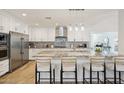 Modern kitchen featuring a granite countertop island, stainless steel appliances, and a stylish backsplash at 4920 E Osborn Rd, Phoenix, AZ 85018
