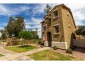 A charming two-story home with lush front yard, walkway and inviting curb appeal at 5612 S 21St Pl, Phoenix, AZ 85040