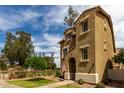 A charming two-story home with lush front yard, walkway and inviting curb appeal at 5612 S 21St Pl, Phoenix, AZ 85040