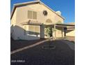 View of back exterior featuring covered patio and desert landscaping at 60 S Willow Creek St, Chandler, AZ 85225