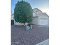 Two-story home featuring desert landscaping and an attached two car garage at 60 S Willow Creek St, Chandler, AZ 85225