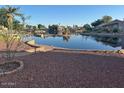Backyard view overlooking calm lake and surrounding community at 60 S Willow Creek St, Chandler, AZ 85225