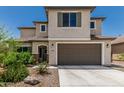 Charming two-story home featuring a neutral color palette and a two-car garage with a concrete driveway at 6305 W Pleasant Oak Ct, Florence, AZ 85132
