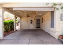 Attached carport featuring a ceiling fan, front door access, and protective covering for vehicles at 6391 S Oakmont Dr, Chandler, AZ 85249