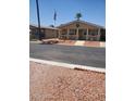 A well-maintained home with a front porch and desert landscaping at 9302 E Broadway Rd # 157, Mesa, AZ 85208