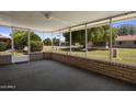 Relaxing enclosed patio with serene backyard view and natural light at 10325 W Prairie Hills Cir, Sun City, AZ 85351
