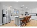 Bright and modern kitchen features white cabinets, stainless steel appliances, and a spacious island at 1036 S 75Th St, Mesa, AZ 85208