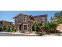 Charming two-story home boasts a red tile roof and well-maintained desert landscaping, offering curb appeal at 10420 N 10Th St # 2, Phoenix, AZ 85020
