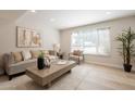 Bright living room with hardwood floors, neutral decor, and large windows at 1301 N 44Th St, Phoenix, AZ 85008