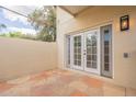 Private outdoor patio with stone flooring and access to the home at 1301 N 44Th St, Phoenix, AZ 85008