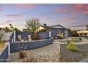Relaxing back yard featuring privacy fence, desert landscaping, and brick patio at 1444 E Coronado Rd, Phoenix, AZ 85006