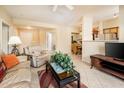 Bright and airy living room showing an open floor plan, perfect for relaxation and gatherings at 14950 W Mountain View Blvd # 7209, Surprise, AZ 85374