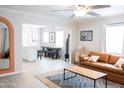 Spacious living area featuring a large sofa, dining table, and seamless connection to the kitchen at 1513 E Sheridan St, Phoenix, AZ 85006