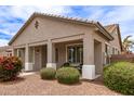 Charming covered front porch adorned with seating, offering a relaxing outdoor space at 18614 E Oriole Way, Queen Creek, AZ 85142