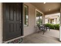 Inviting front porch featuring outdoor seating and a welcoming entrance at 18614 E Oriole Way, Queen Creek, AZ 85142
