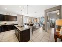 Open-concept kitchen seamlessly connects to the dining and living areas, promoting social gatherings at 23690 W Ripple Rd, Buckeye, AZ 85326