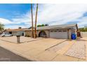 Charming single story home with brick accents, desert landscaping, and attached two car garage at 4062 W Mescal St, Phoenix, AZ 85029