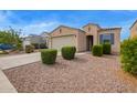 Single-story house featuring desert landscaping with a well-maintained front yard and a two-car garage at 4424 W Vervain Ave, San Tan Valley, AZ 85144