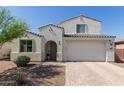 Charming two-story home with a two-car garage and desert landscaping at 5330 W Thresher Way, Laveen, AZ 85339