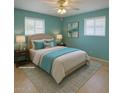 Comfortable bedroom features carpet, two windows and ensuite bathroom at 5342 E Des Moines St, Mesa, AZ 85205