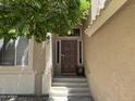 Inviting front door with decorative accents and covered entry providing a welcoming entrance to the home at 113 N Albert Dr, Chandler, AZ 85226