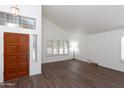 Bright living room with modern flooring, large windows, and a clean, minimalist design at 113 N Albert Dr, Chandler, AZ 85226
