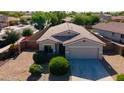 Lovely home featuring desert landscaping and a private two-car garage, creating curb appeal at 13170 W Clarendon Ave, Litchfield Park, AZ 85340