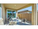 Relaxing covered patio with comfortable seating, ideal for enjoying the outdoors at 16739 W Charlotte Dr, Surprise, AZ 85387