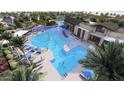 Expansive community pool area featuring lap lanes, leisure zones, and comfortable lounging spaces at 16933 W Bronco Trl, Surprise, AZ 85387