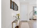 Bright entryway featuring a decorative console table with modern decor and ample natural light at 32347 N Vernal Ln, San Tan Valley, AZ 85144