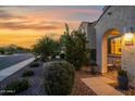 Inviting front entrance with desert landscaping and charming details, leading to a cozy home at 32347 N Vernal Ln, San Tan Valley, AZ 85144