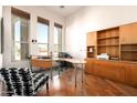 Bright home office with large windows, wood floors, and ample storage at 35108 N 139Th Way, Scottsdale, AZ 85262