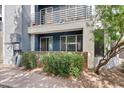Exterior of condo building with neutral paint and wrought iron balcony at 3633 N 3Rd Ave # 1035, Phoenix, AZ 85013