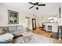 Inviting living room with a ceiling fan, hardwood floors, and an open concept floorplan at 3633 N 3Rd Ave # 1035, Phoenix, AZ 85013