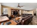 Inviting living room with entertainment center and comfortable leather furniture for relaxation at 4038 E Wrangler Ct, Gilbert, AZ 85297